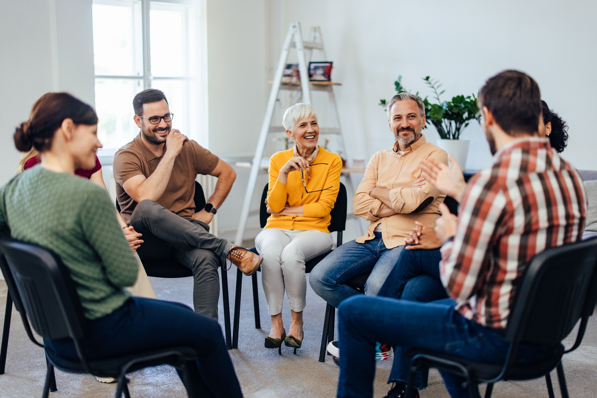 Focus on the people, having a group mental health therapy, talking to each other.
